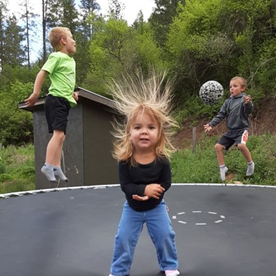 Dally Sue my great grandaughter is playing with her brothers, Cash and Roper at their home in Juliaetta, Idaho.  Taken summer of 2021.