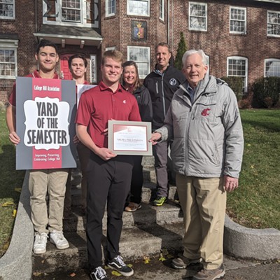 The College Hill Association board of directors, Pullman Mayor Glenn Johnson, and Pullman Director of Community Development RJ Lott present the Fraternity Yard of the Semester award to Sigma Phi Epsilon Philanthropy Chair Jack Hirsch, along with other members on November 6. The property is located at 610 NE California Street in Pullman.