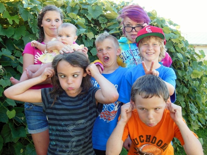 Cousins gathered for a picture at thier Grandma Val's house. Olivia, Chloe,Dylan, Morgan, Maggie, Lilly and Ian enjoy making the "crazy faces" at the 4th of July family BBQ.