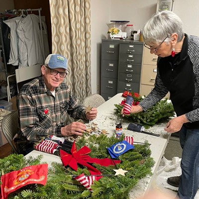 David Purtee, Col. USAF retired, and Lee Ann Mingo prep the entry wreaths.

The public is welcome at a ceremony for laying of the wreaths at the Burnt Ridge Cemetery at 9:00 a.m. on Saturday, December 17. A repeat ceremony will be held at Beulah Cemetery at 1:00 p.m. the same day. The other cemeteries will be decorated with wreaths at the entrance and on sponsored veterans’ graves. Due to snow conditions in the rural areas, no ceremonies are scheduled.