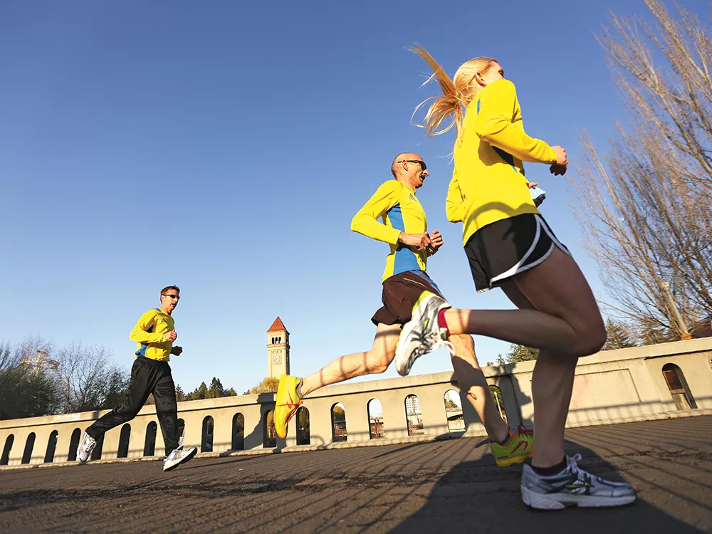 2013 Boston Marathon finishers Keith Brownlee and Bryanna Gondeiro finish a 2.62-mile tribute run on April 22. - YOUNG KWAK