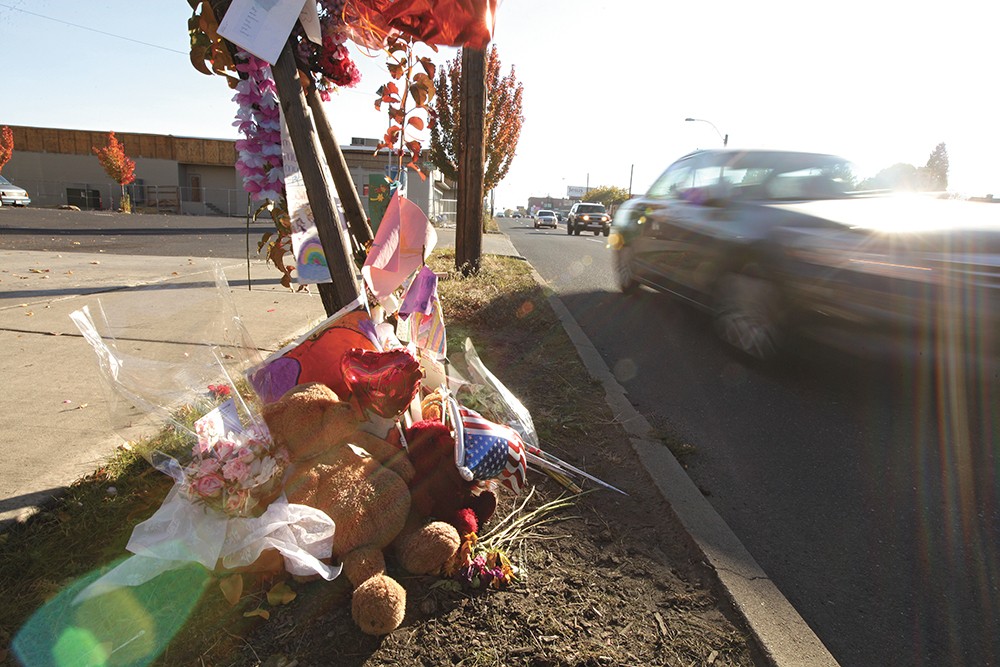 A memorial dedicated to Elayna Burrows-Gust grows along a stretch of North Monroe Street. - YOUNG KWAK