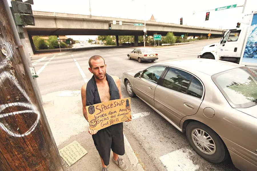 A panhandler in downtown Spokane in summer 2012. - YOUNG KWAK