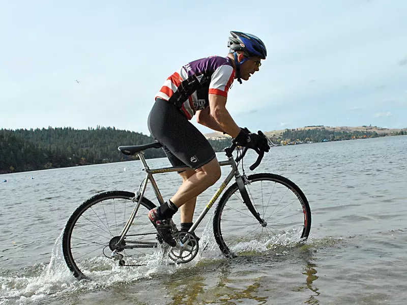 A rider dukes it out with the Liberty Lake course last month. - CHRIS STEIN