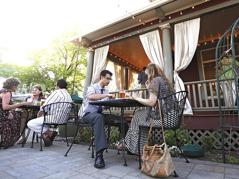 A summer evening on the patio at EJ's Garden Bistro in Browne's Addition. - YOUNG KWAK