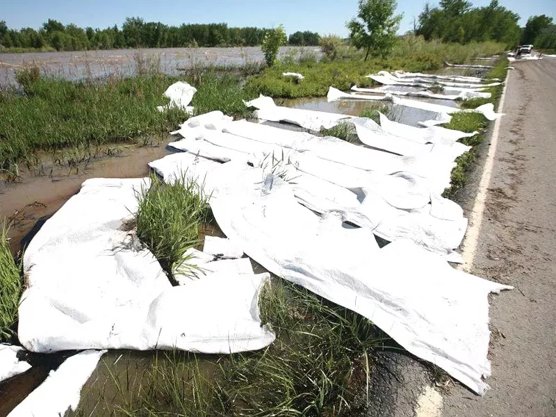 Absorbent pads try to contain the oils in the Yellowstone River. - BILLINGS GAZETTE