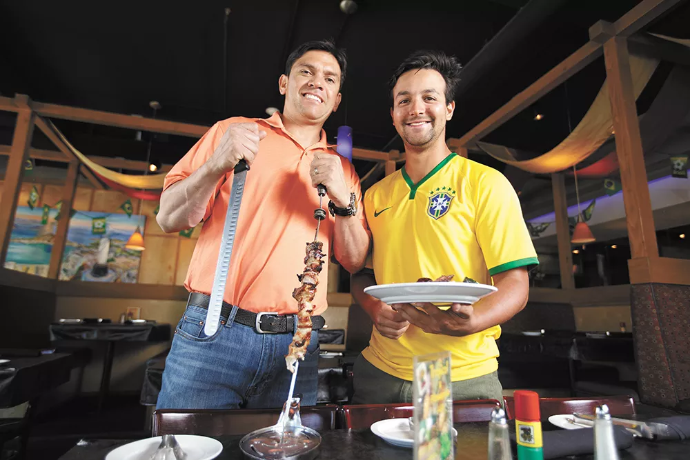 Adriano de Souza (left), owner of Grille from Ipanema, with friend and fellow soccer fan Eduardo Amorim. - YOUNG KWAK