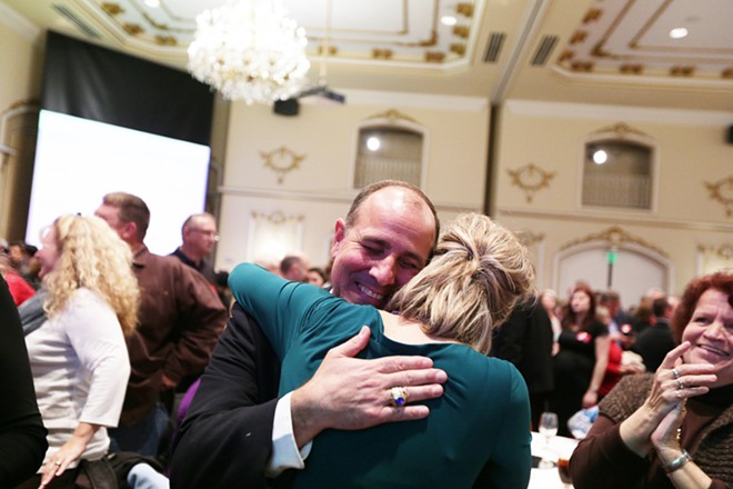 After first election results Spokane County Clerk Timothy Fitzgerald (R), left, hugs Tracy Pendarvis. - YOUNG KWAK