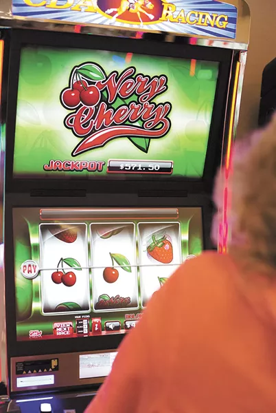 After the cherries spin, a horse race snippet plays on the screen below. - YOUNG KWAK