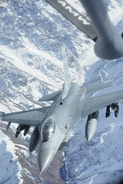 An F-16 soars away after getting fuel from a KC-135 tanker over northern Afghanistan. - YOUNG KWAK
