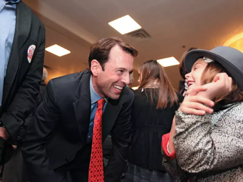 Andy Billig, celebrating his election to the Washington State Senate, courts a future voter at an election night party at Spokane’s Red Lion hotel. - YOUNG KWAK