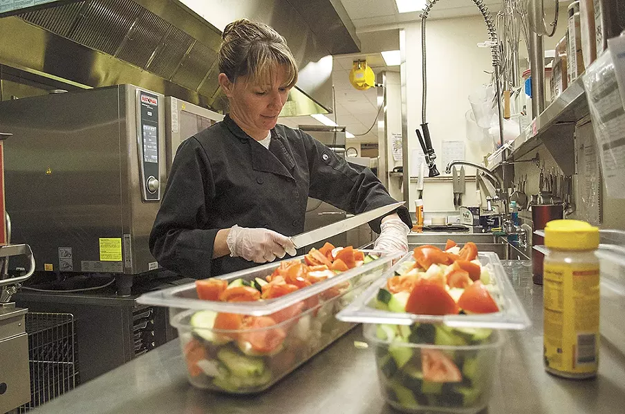 Assistant cook Rene Mahaffy crafts a brightly colored, fresh salad.