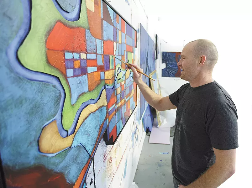 At his studio, Ben Joyce paints "Spokane" for Windermere City Group. - YOUNG KWAK