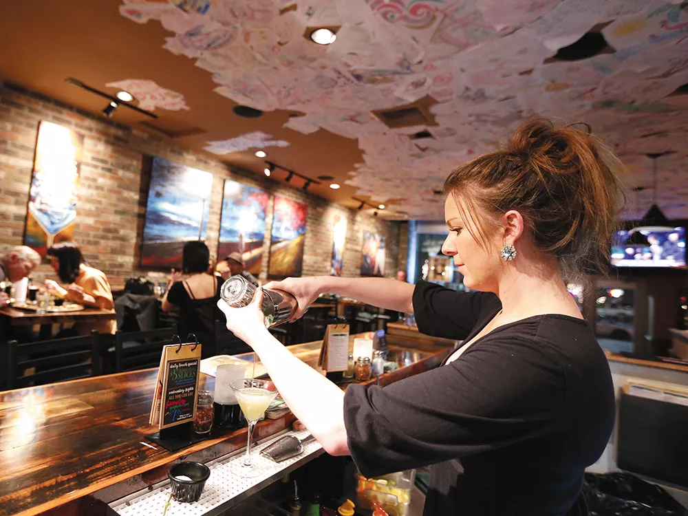 Bartender Sara Barnes makes a drink at Ciao Mambo during the opening weekend of Spokane Restaurant Week. - YOUNG KWAK