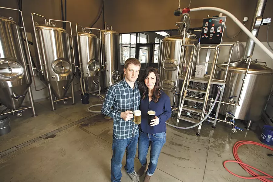 Ben and Christy Lukes in the new Perry Street Brewing facility. - YOUNG KWAK