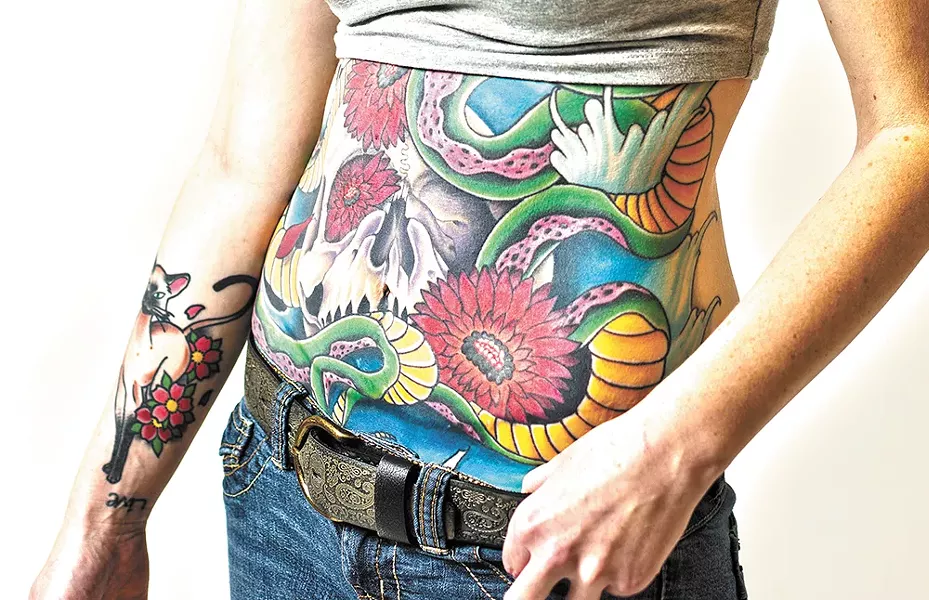 Beth Hill's belly tattoo has required 25 hours in the artist's chair, and there's still work to be done. - YOUNG KWAK