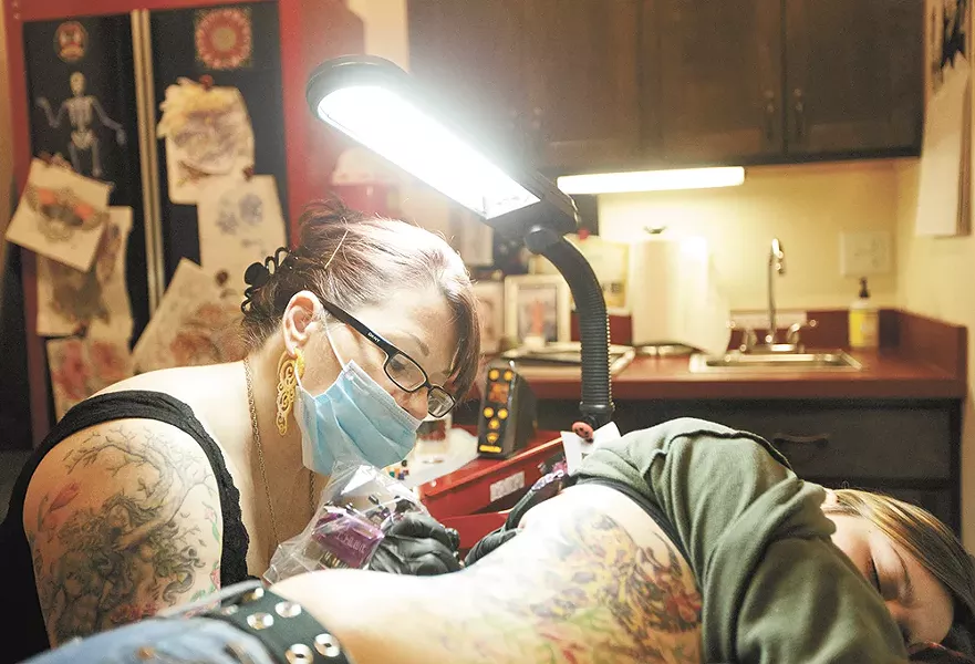 Beth Swilling, owner of Mom's Custom Tattoo and Body Piercing in Spokane, is part of a new breed of fine artists now working in the industry. - YOUNG KWAK