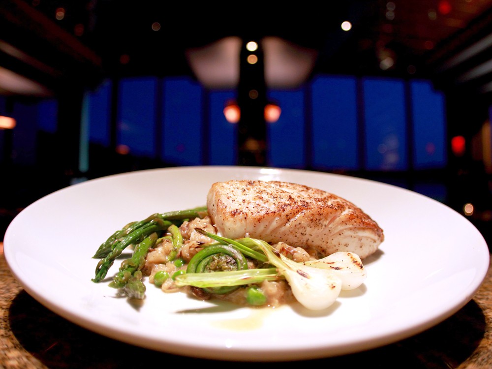 Beverly\'s fresh halibut is served with zesty spring risotto. - JOE KONEK