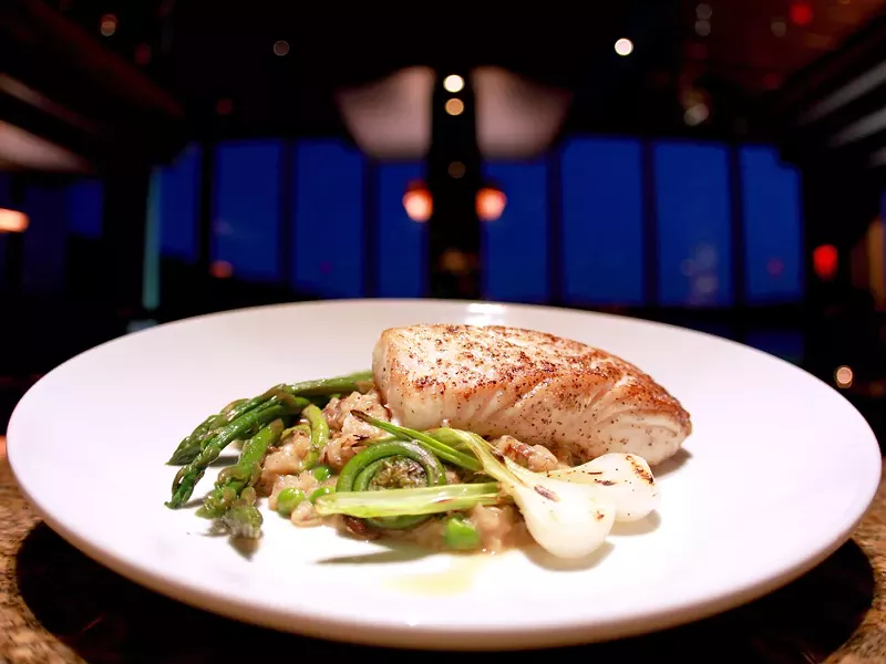 Beverly\'s fresh halibut is served with zesty spring risotto. - JOE KONEK