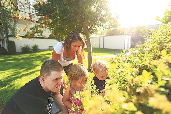 Brajee Green, second from left, grew up surrounded by abuse. But she and husband Ken have determined that raising their children, Kenny and Sophia, will be different.