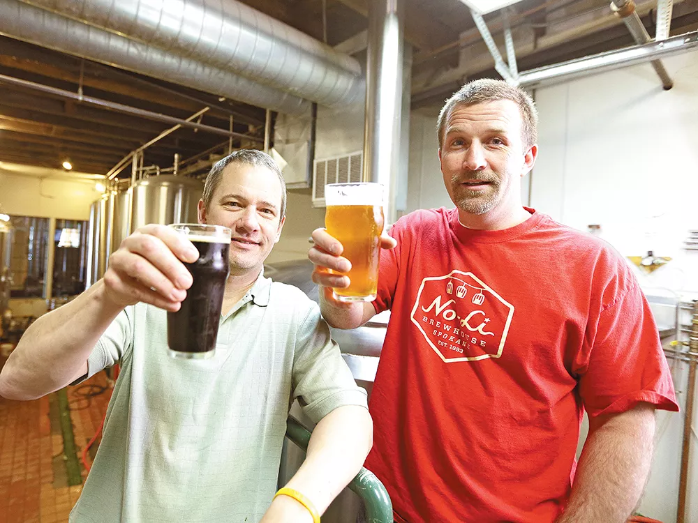 Brewmaster Mark Irvin (left) and partner John Bryant toast their creations inside the No-Li Brewhouse. - YOUNG KWAK