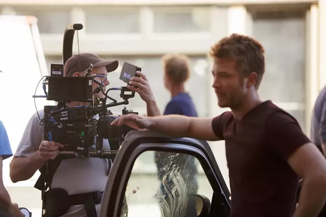 Camera Operator Stephen McGehee, left, prepares for a scene as Mack (Michael Welch) waits. - YOUNG KWAK