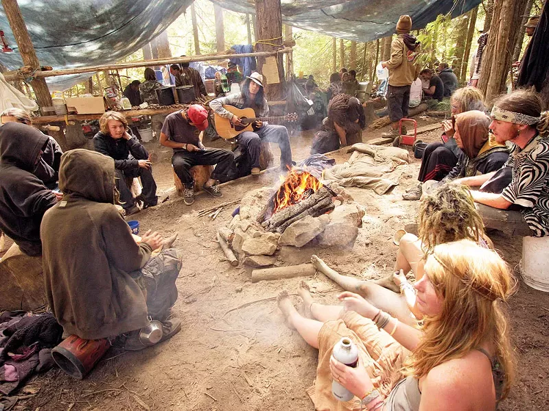 Campers listen to music at the Montana Mud camp, during the Rainbow People gathering in the Colville National Forest. - YOUNG KWAK