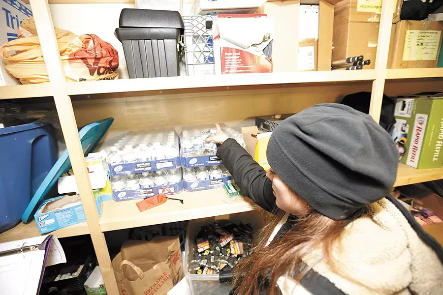 Carletta Gaston gets supplies for her outreach efforts. - YOUNG KWAK
