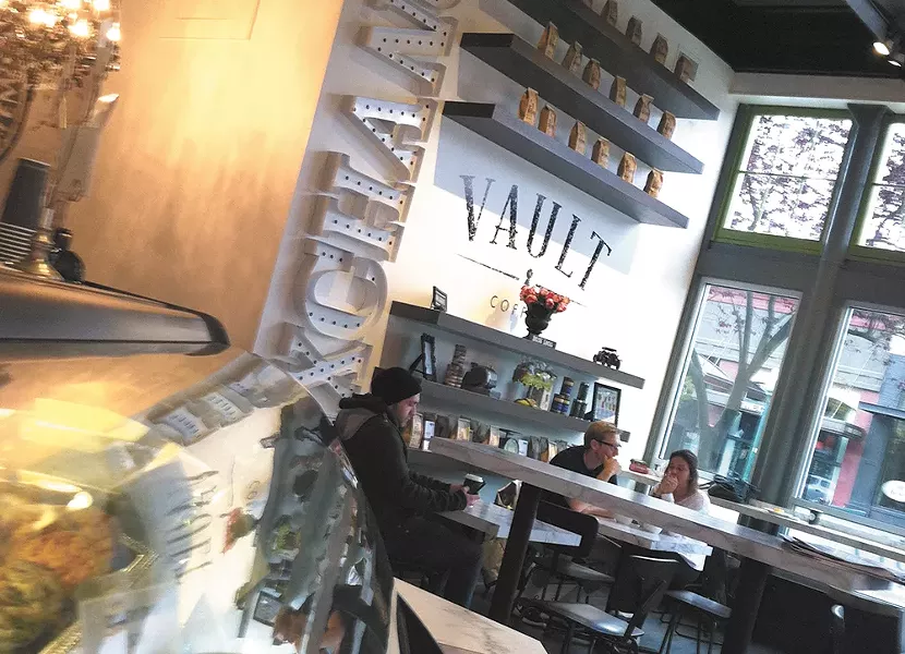 CdA's newest coffee shop focuses on a banking theme inspired by its building's original use. - CARRIE SCOZZARO