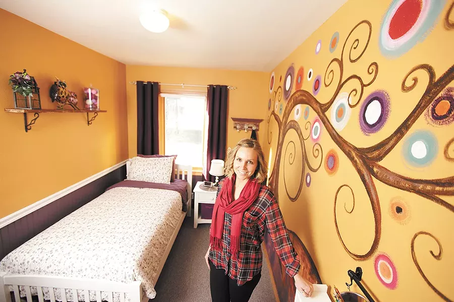 Christina Hull in one of the Children's Village's newly decorated rooms. The nonprofit aims to double its capacity to serve up to 200 North Idaho kids who need a safe place to stay. - YOUNG KWAK