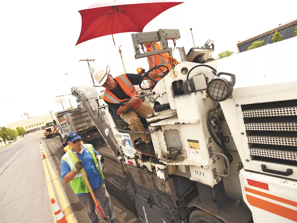 City street crews at work on Monday. Mayor Condon has outsourced several street projects to private contractors. - YOUNG KWAK