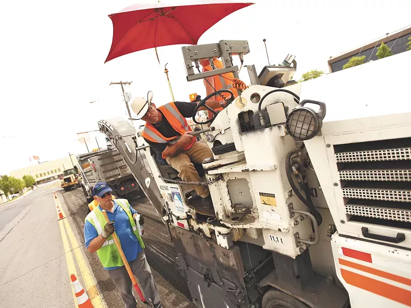 City street crews at work on Monday. Mayor Condon has outsourced several street projects to private contractors. - YOUNG KWAK