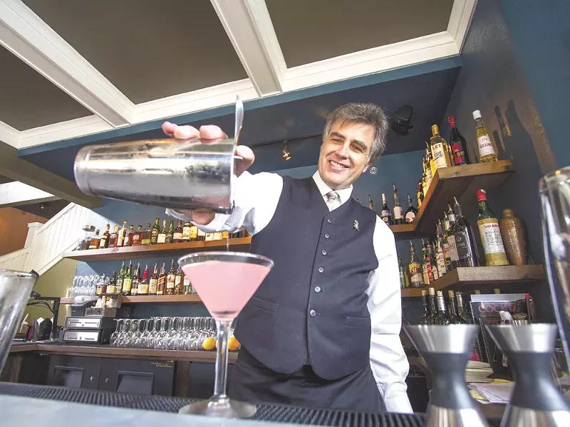 Clover bartender John Tindley pours a cocktail from the new restaurant’s expansive drink list. - JEFF FERGUSON