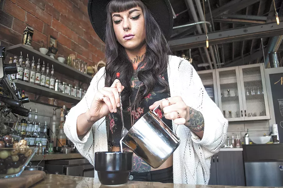 Coffee artisan Allie-Marie Evans pours steamed milk at Cafe Affogato. - SARAH WURTZ