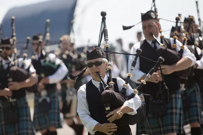 Columbia Regional Pipe Band member Judy Morrison, front, performs during the opening ceremonies. - YOUNG KWAK