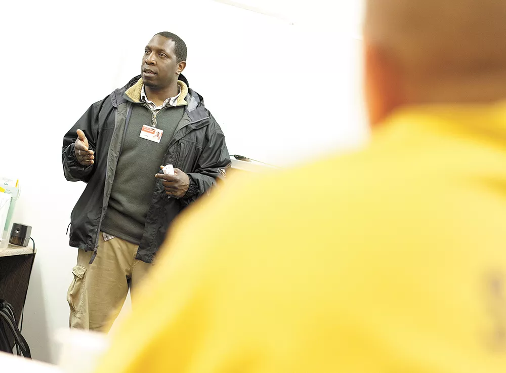 Community Minded Enterprises in-person assister Robert Martin talks about the benefits of having health insurance during a class at Geiger Corrections Center. - YOUNG KWAK