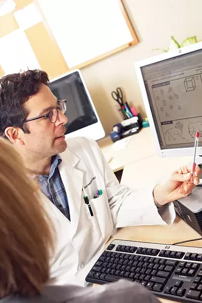 Dr. David Greeley of Northwest Neurological demonstrates a memory test. - YOUNG KWAK