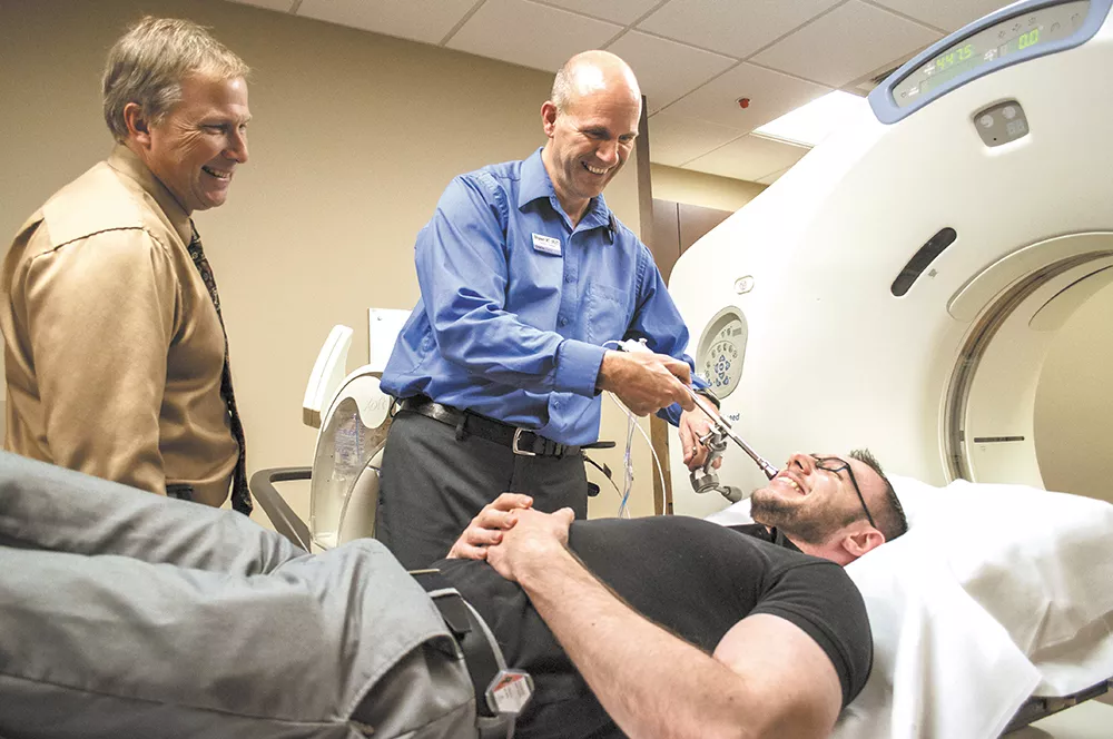 Dr. Frank Lamm (left), a radiation oncologist at Spokane CyberKnife, has treated about a dozen patients this year. - SARAH WURTZ