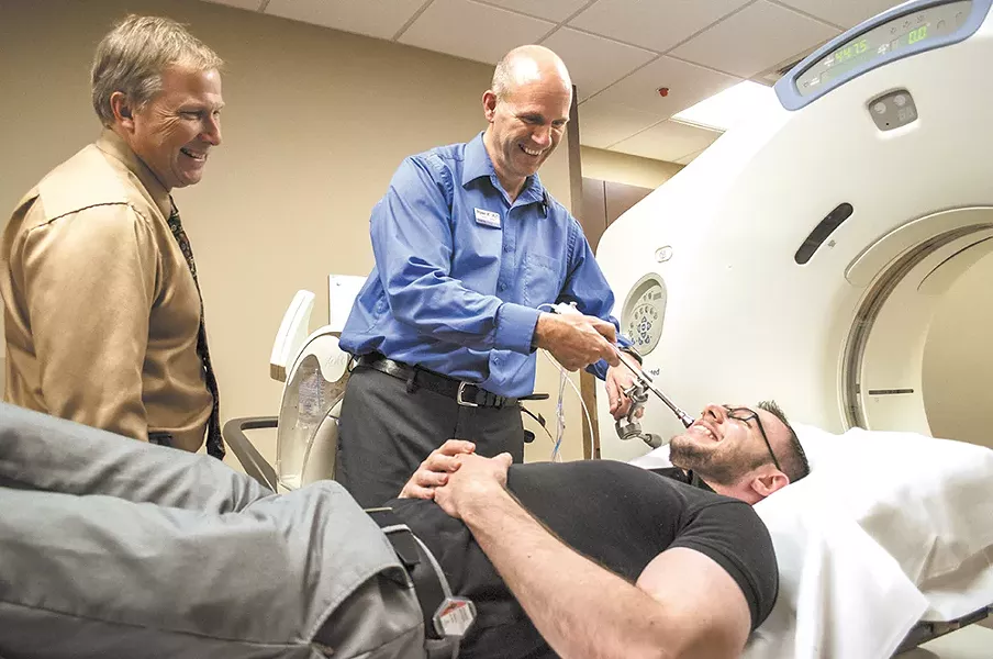 Dr. Frank Lamm (left), a radiation oncologist at Spokane CyberKnife, has treated about a dozen patients this year. - SARAH WURTZ
