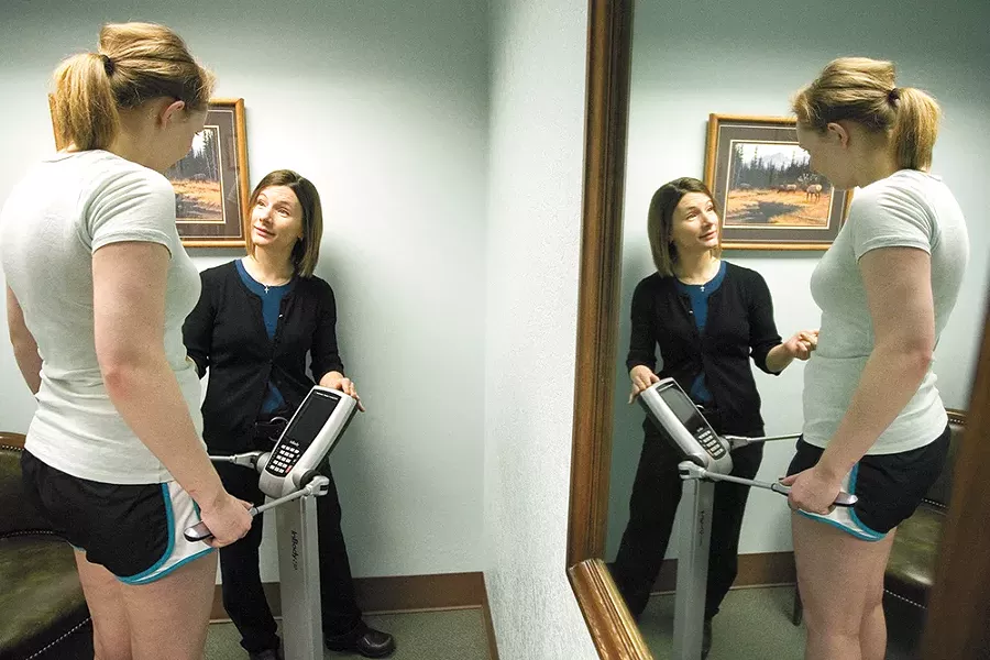 Dr. Rayme Geidl assesses body fat and muscle mass at Moscow Medical. - GEOFF CRIMMINS