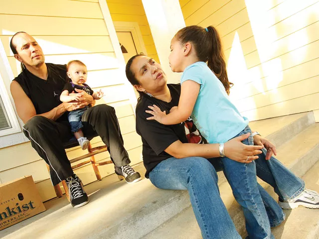 Duane Garvais and LoVina Louie, shown with daughters North Star, 3, and Dolly, 7 months, are part of an emerging trend of home ownership among Native Americans - YOUNG KWAK