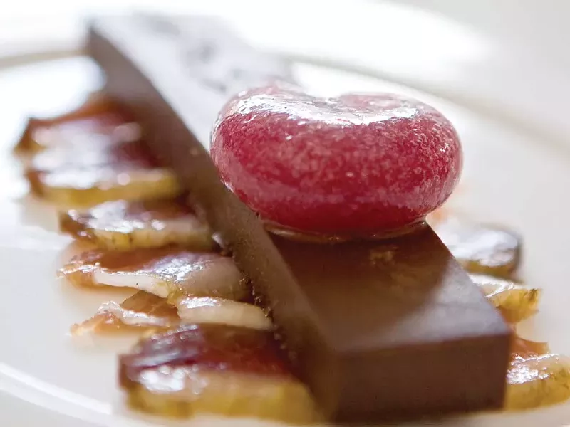 Duck prosciutto and chocolate with pomegranate sphere - coming soon to Sapphire Lounge. - STEPHEN SCHLANGE