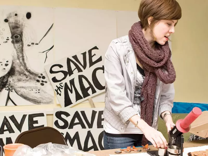 Erica Roberts at the home of Karen Mobley making Save the Mac buttons. - STEPHEN SCHLANGE