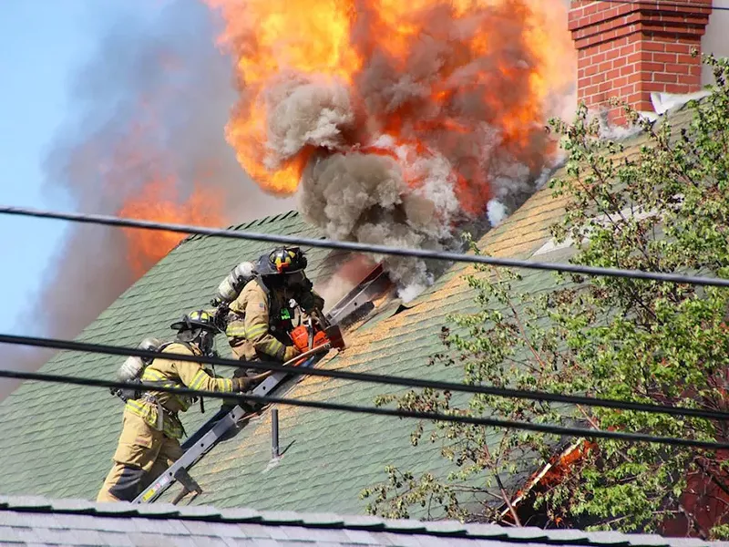 Firefighters battle the fire at a century-old home on Nora Avenue. - CITY OF SPOKANE FIRE DEPARTMENT