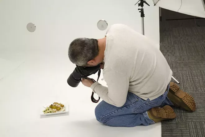 Inlander photographer Young Kwak photographs one of many Restaurant Week dishes in our studio this afternoon — lots of delicious food photos headed your way. - LISA WAANANEN