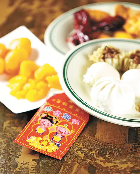 Food from Canaan Buffet, along with the traditional envelopes used to gift money. - YOUNG KWAK