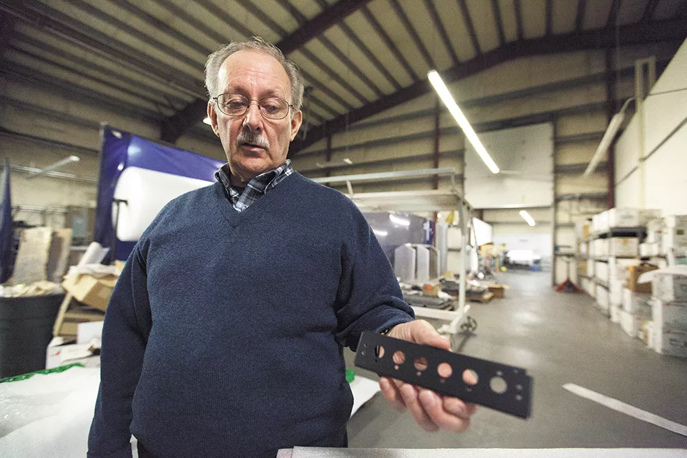 Fred Brown, vice-president of L&M Precision Fabrication, has seen major growth in his company in Spokane County — though he says operations would be much cheaper in Idaho. - YOUNG KWAK