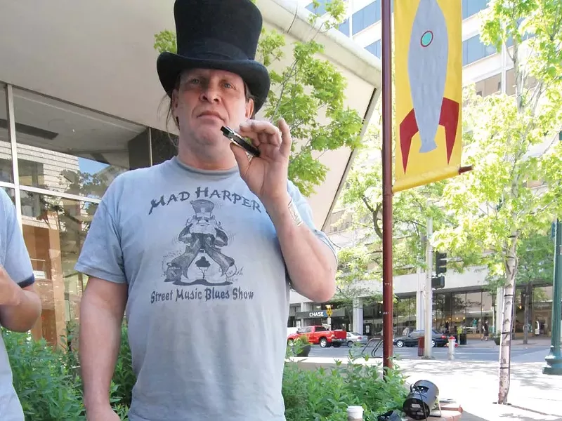 Harpman Hatter's amplified harmonica helped instigate a proposed change in city law. - TAMMY MARSHALL