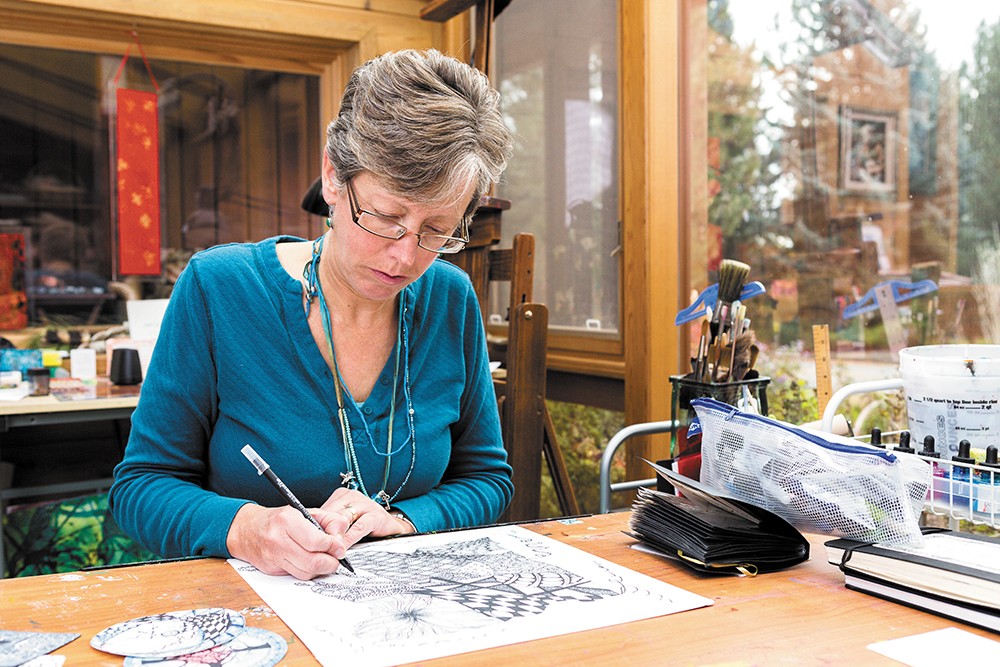 Instructor Loretta West works on a large Zentangle in her home studio. - STEPHEN SCHLANGE