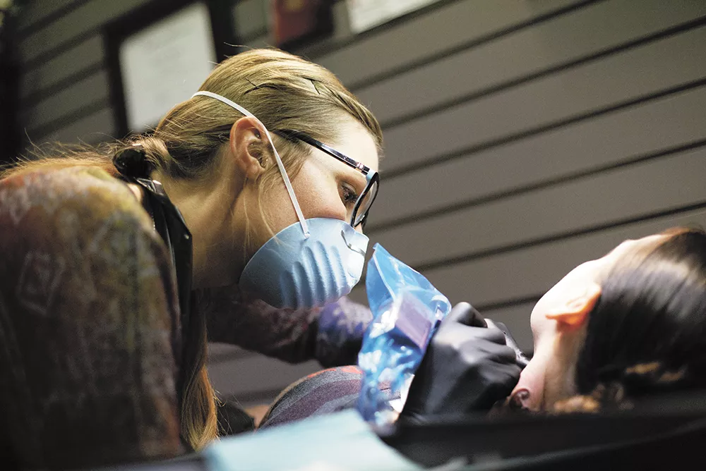 Jacque Gibson Kloehn is offering free tattoo removal to women at the YWCA, Lutheran Community Services and Isabella House. - YOUNG KWAK